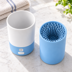 CleanPaw white and blue cleaner, brush insert and charging cable